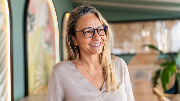 Elder blonde woman smiling.