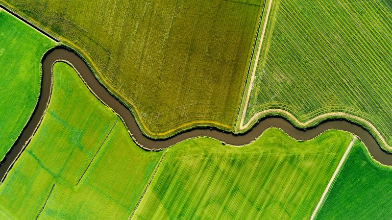 river running through countryside.