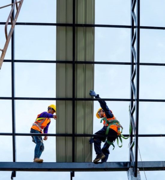 construction workers working on a roof