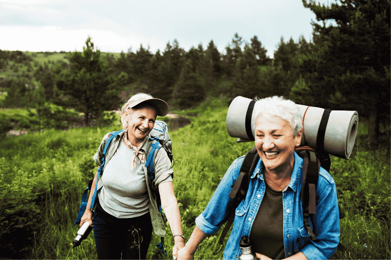 Two retiree women hiking