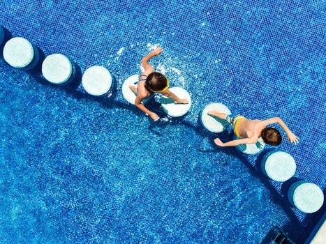 Children running in the pool