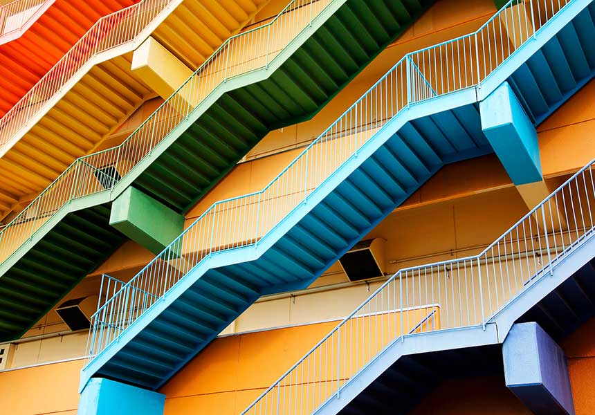 Four stairs on a yellow color wall