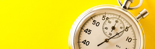 image of a stop watch on yellow background