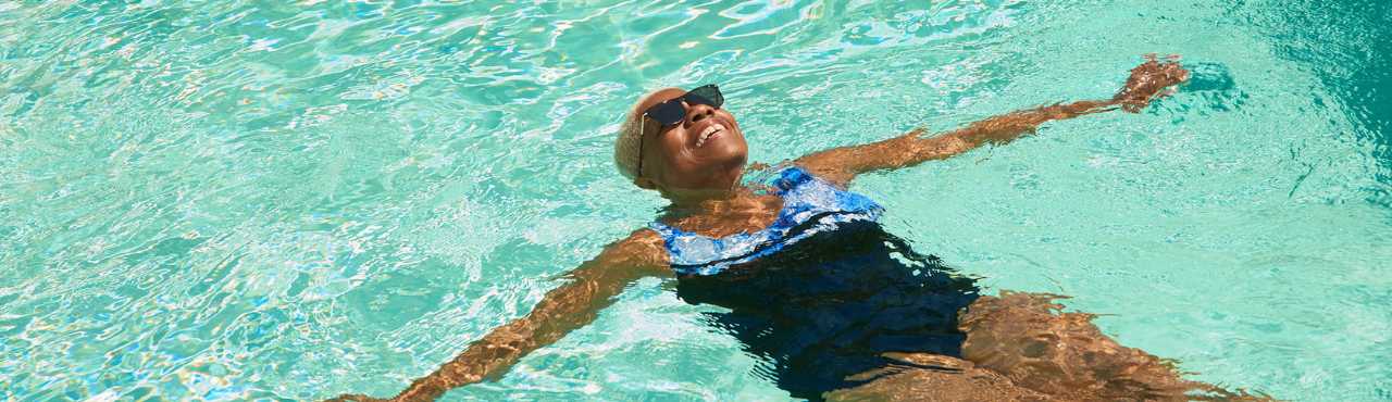 woman floating in pool