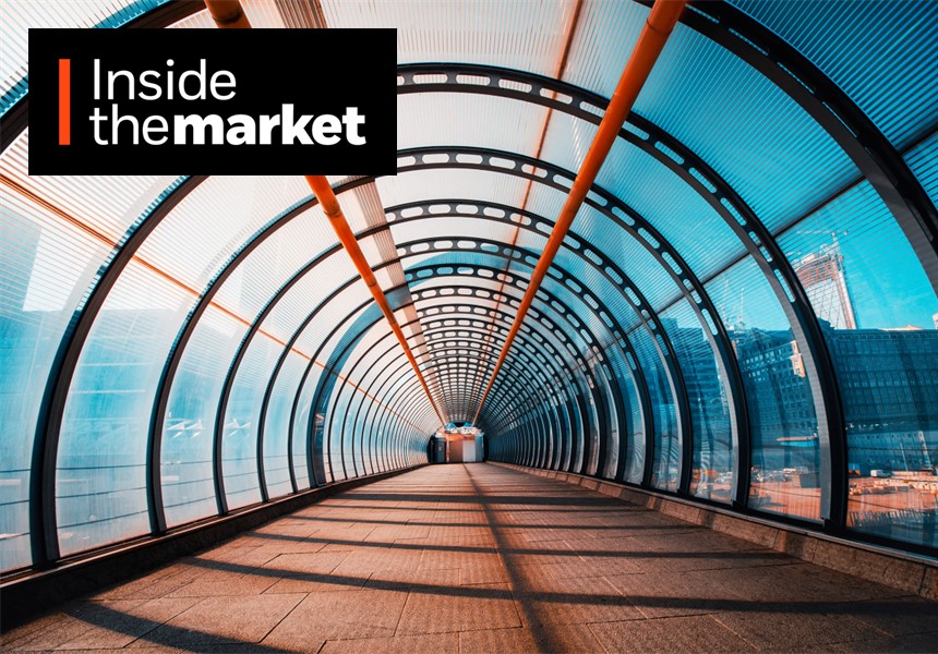 Glass tunnel walkway with Inside the Market logo.