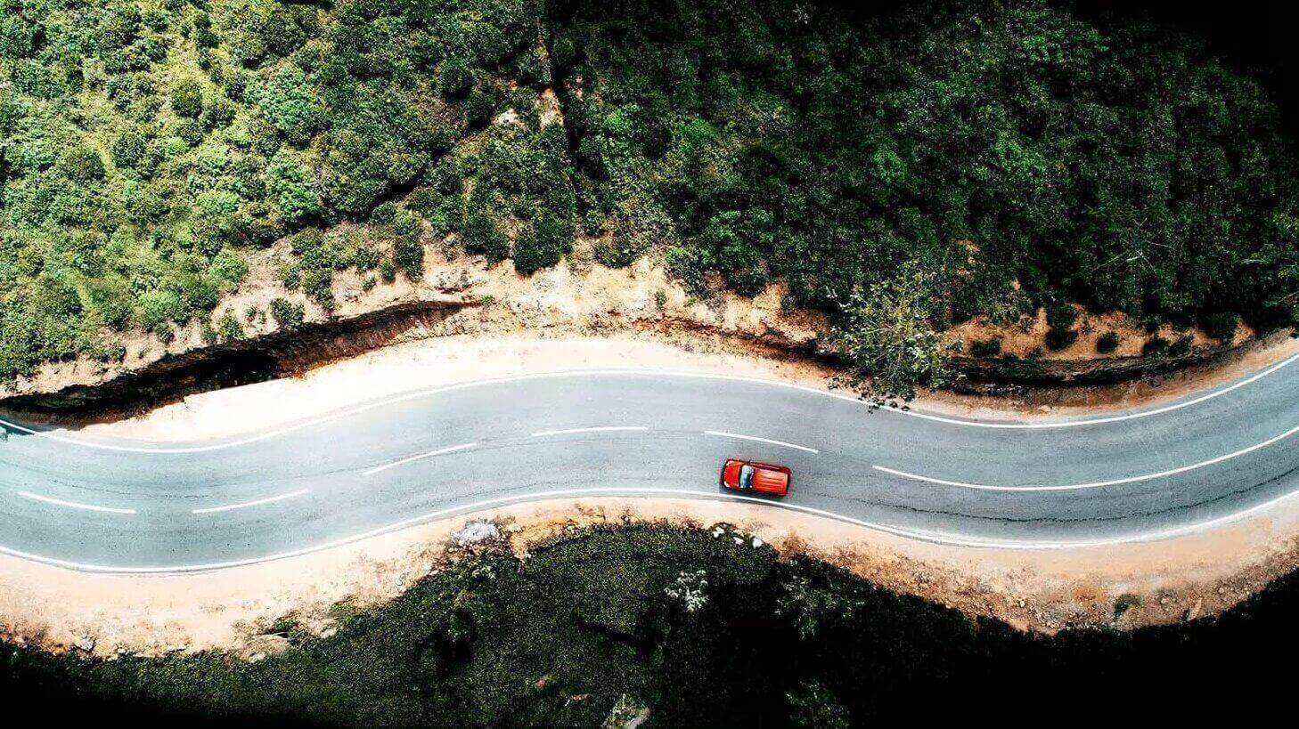 Car driving on hilly area