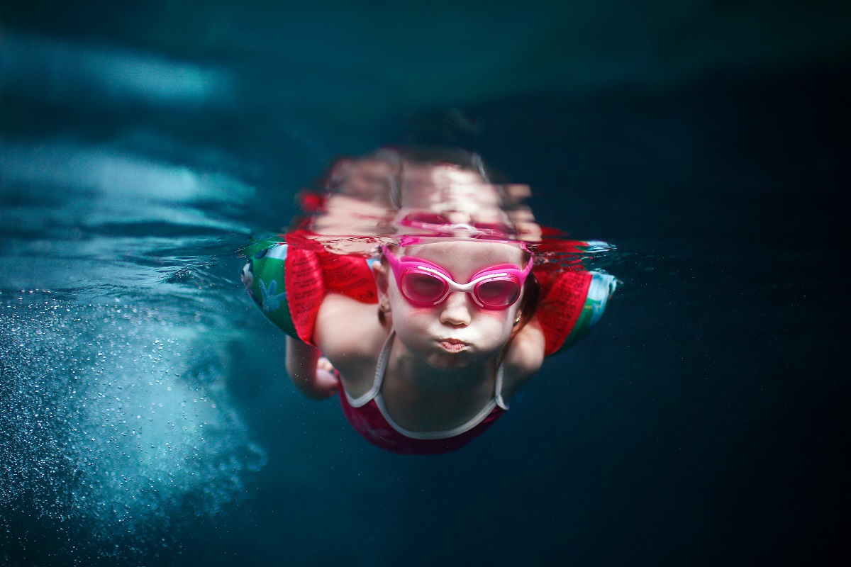 A child swimming in a pool