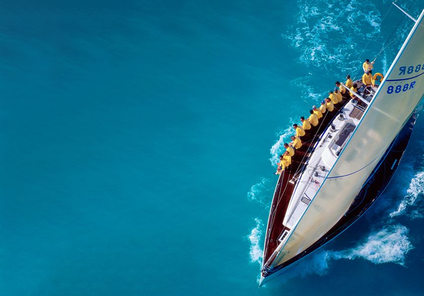 aerial shot of a single racing sailing boat