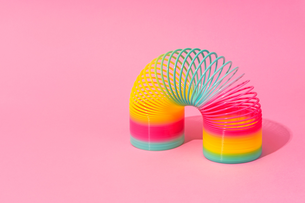 Colorful spring toy arranged in an arc