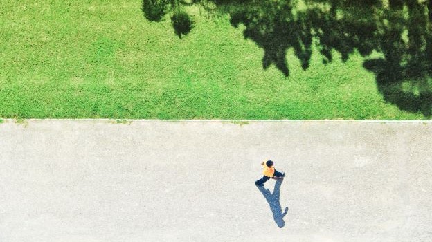 view from above of man walking in a park