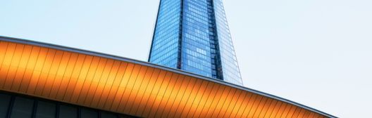 Skyscraper behind a modern buildings